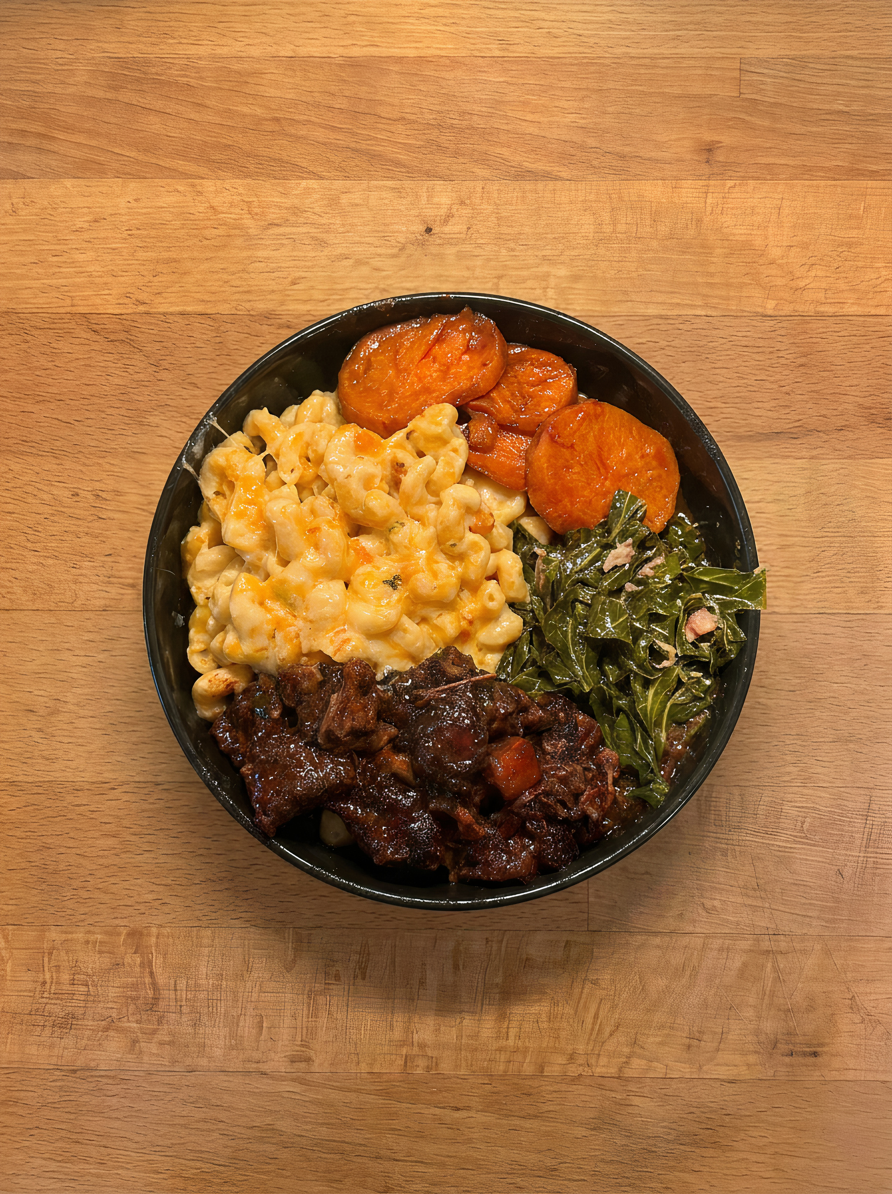Braised Oxtail with Mac & Cheese, Candied Yams, and Collard Greens